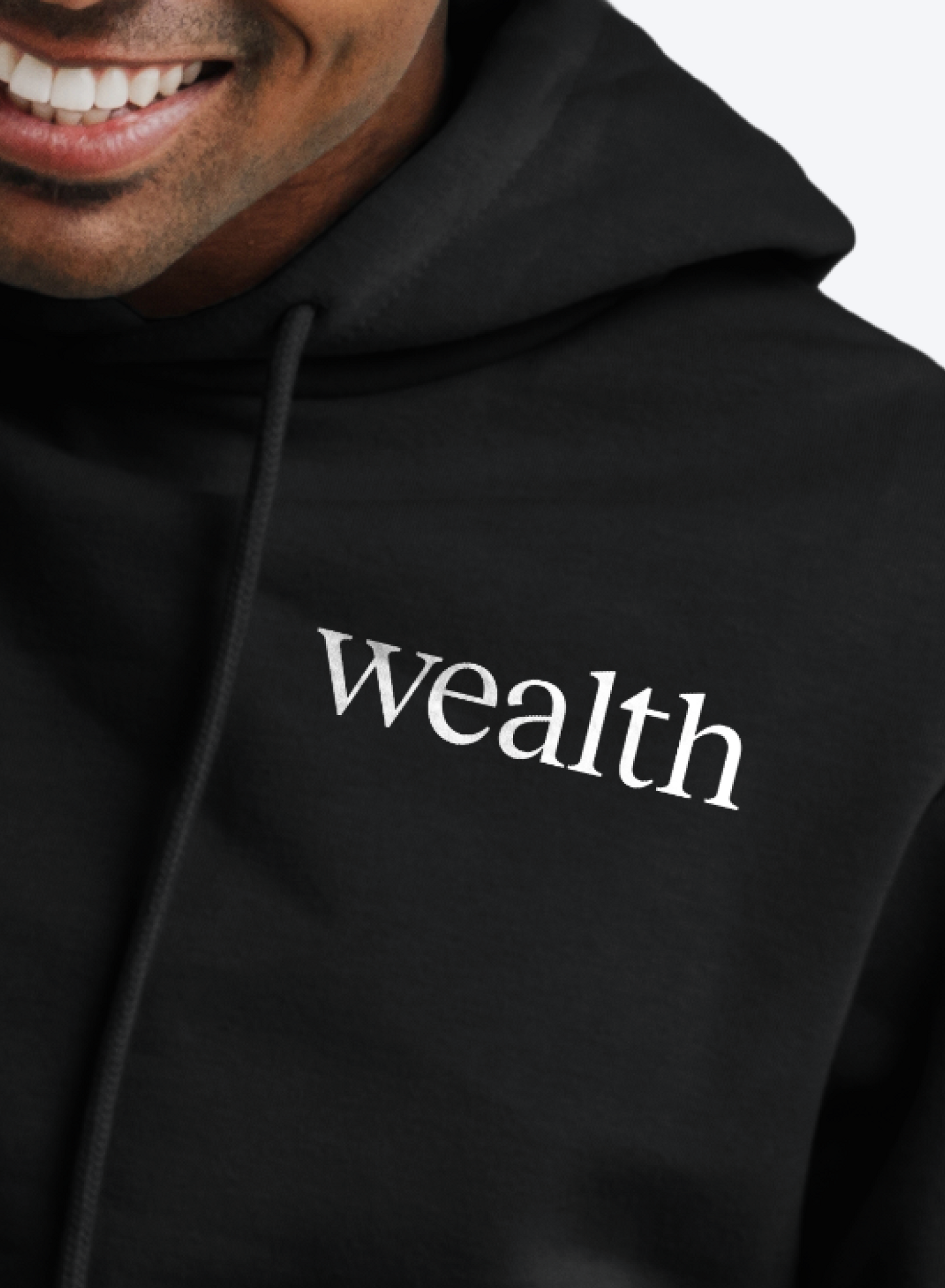 a person wearing Wealth-branded hoodie