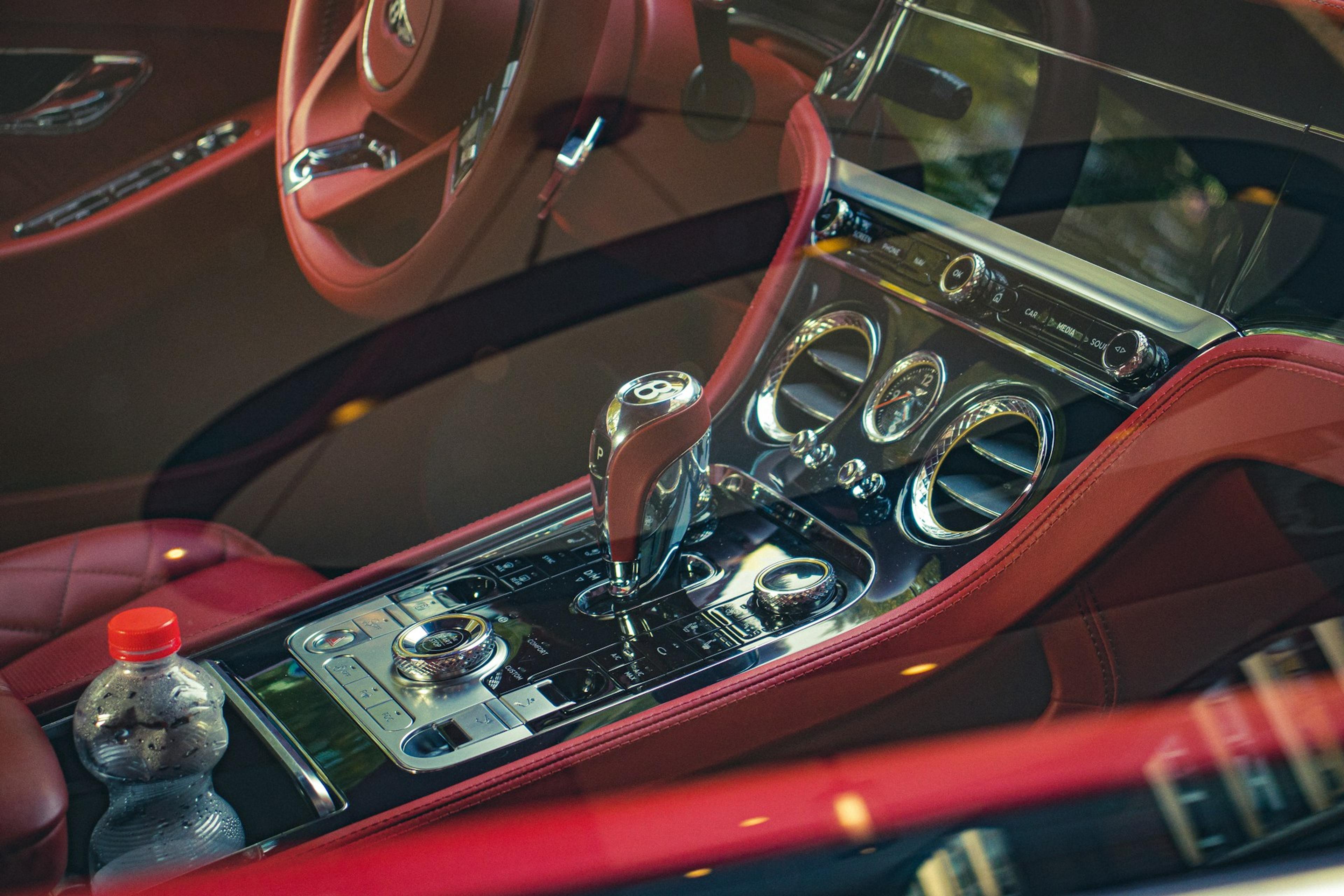Bently car interior with a red leather dash board