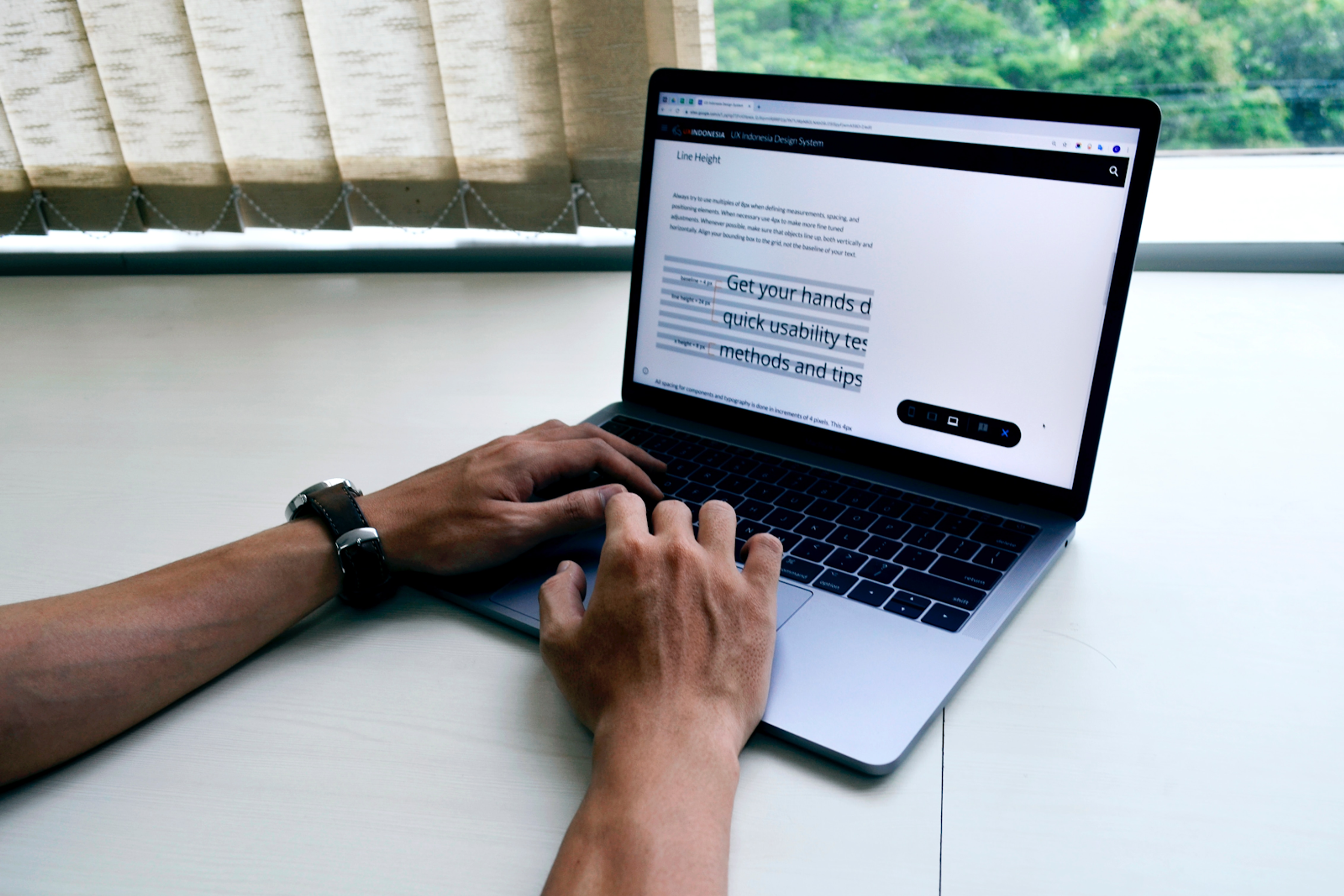 Hand typing something on a laptop keyboard