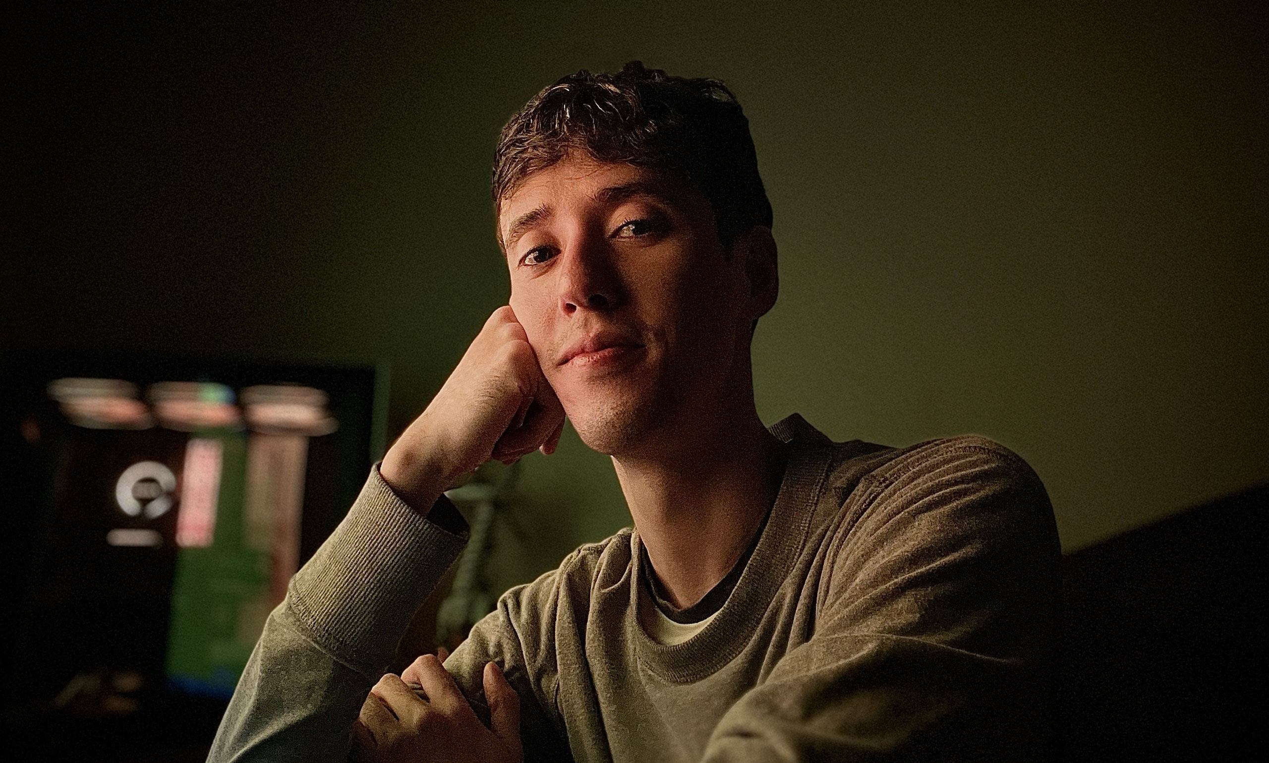 Portrait of a man sitting at his computer desk