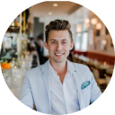 Headshot of a man with a blazer and shirt
