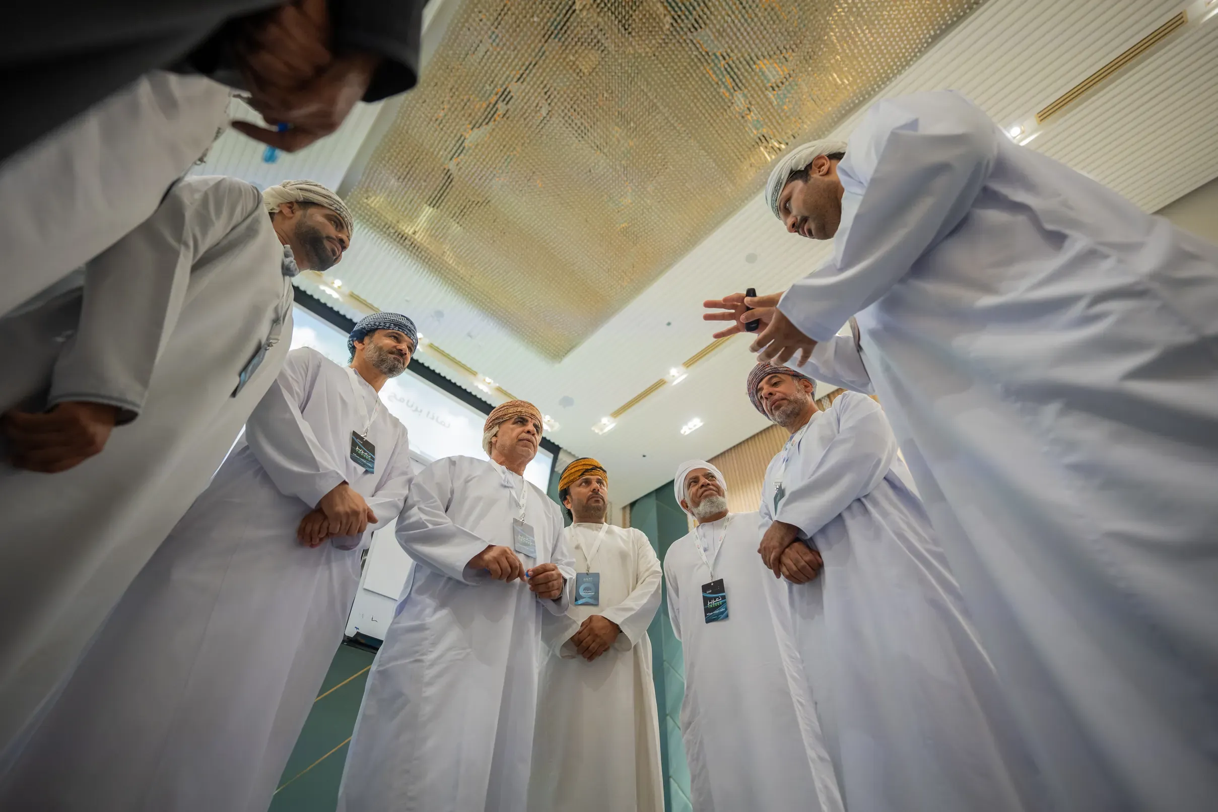 A group in discussion, seen from below
