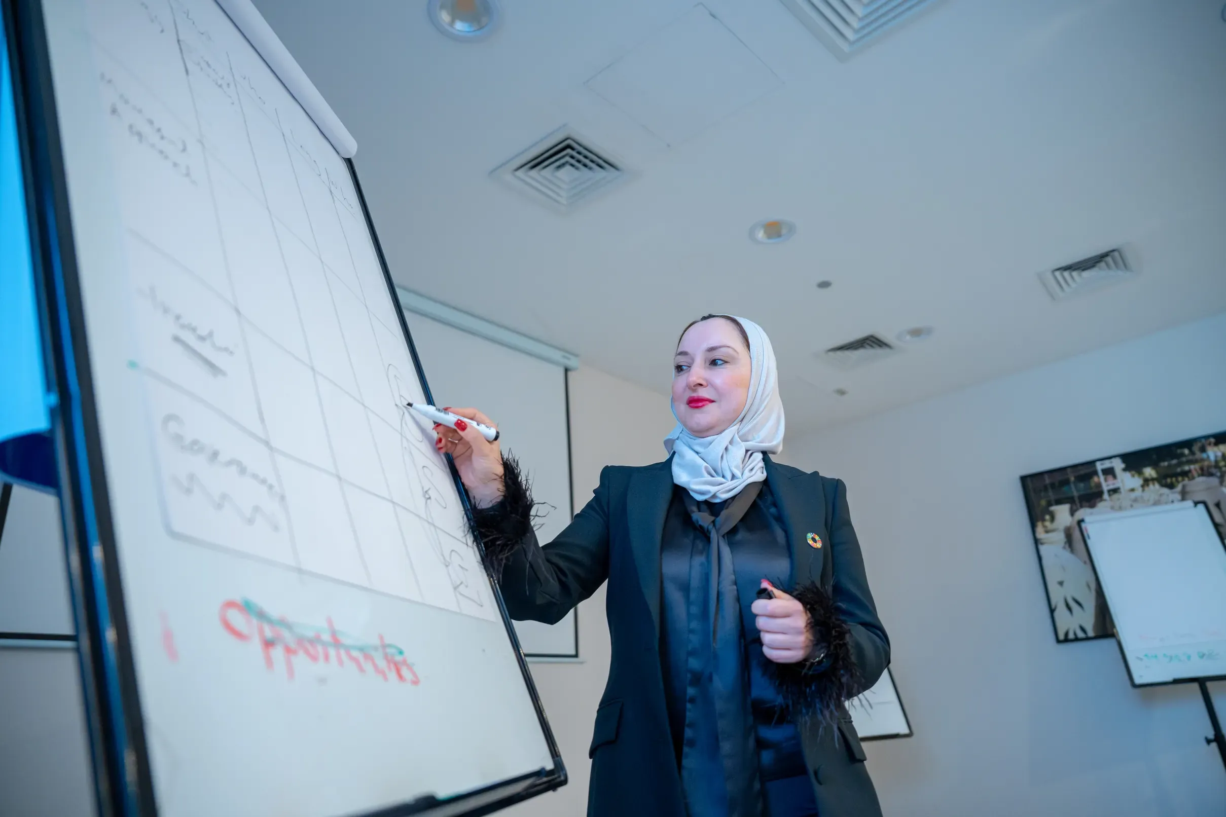 A trainer at the flipchart