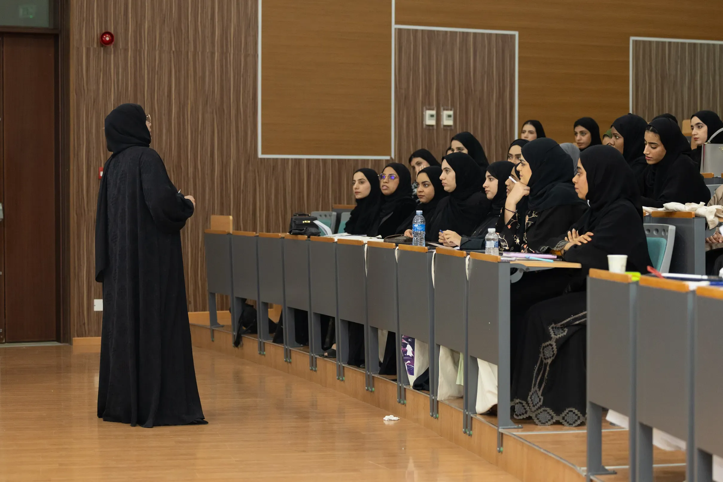 Women seated in rows at a training session