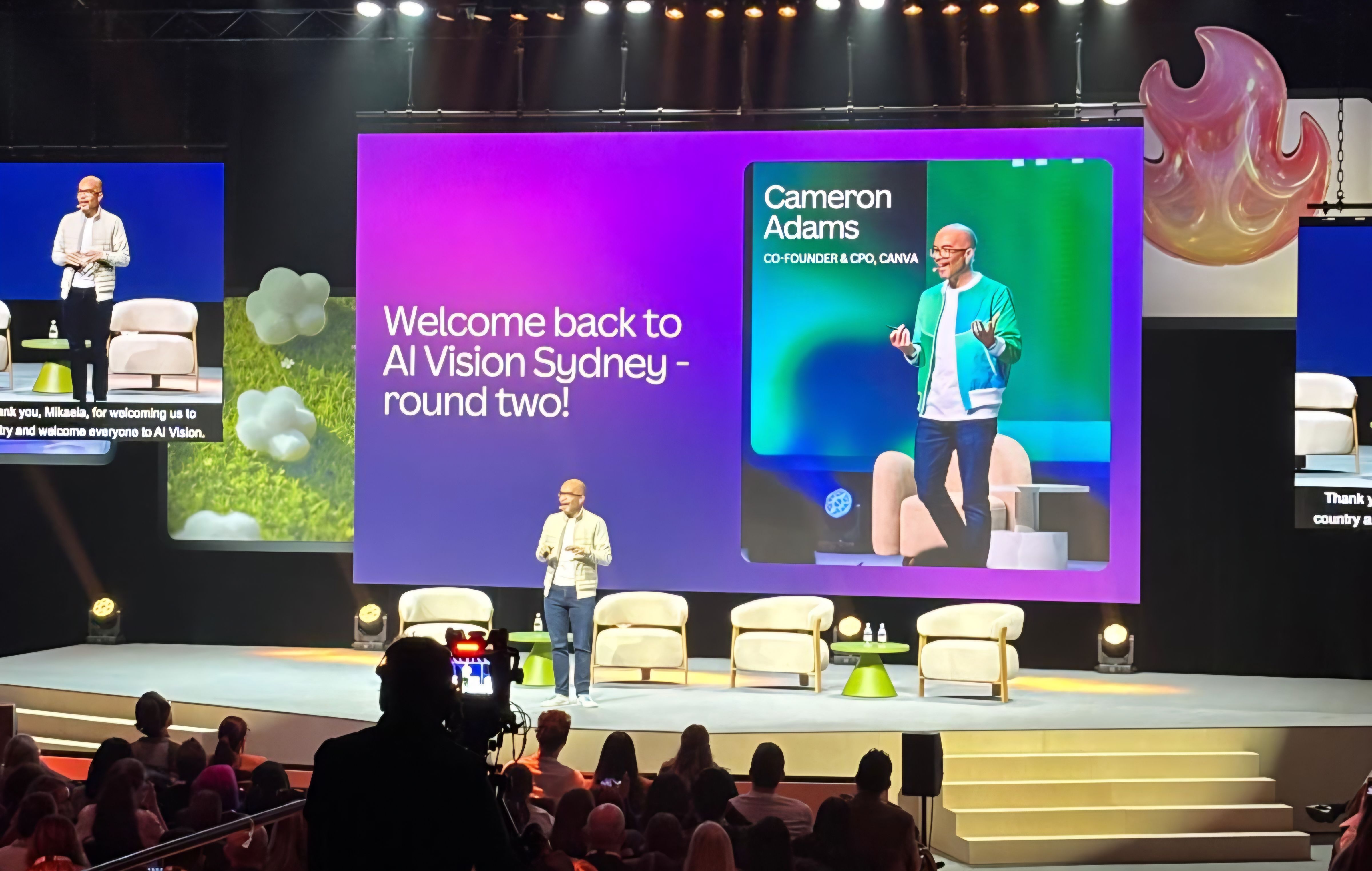 Cameron Adams standing on stage at Canva AI Vision Sydney in August 2026
