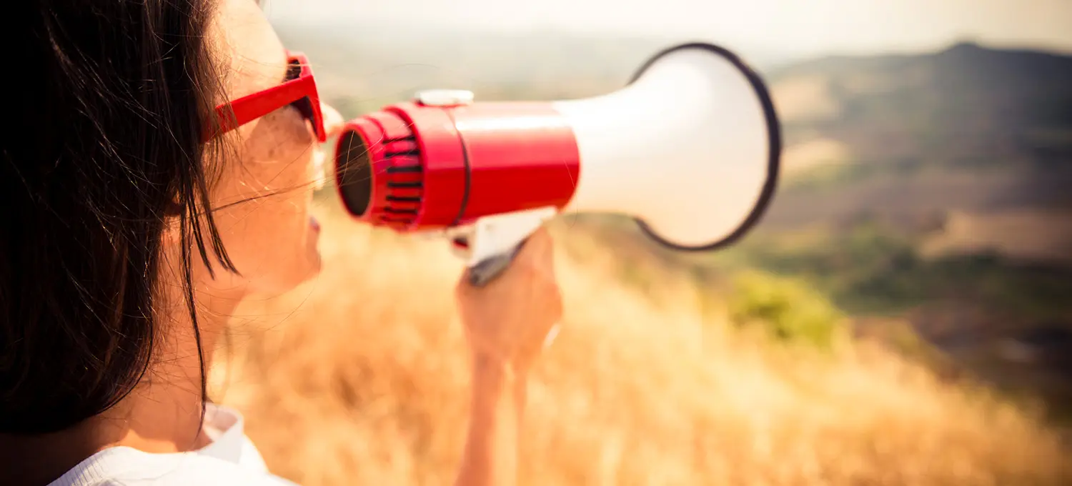 Business woman with megaphone