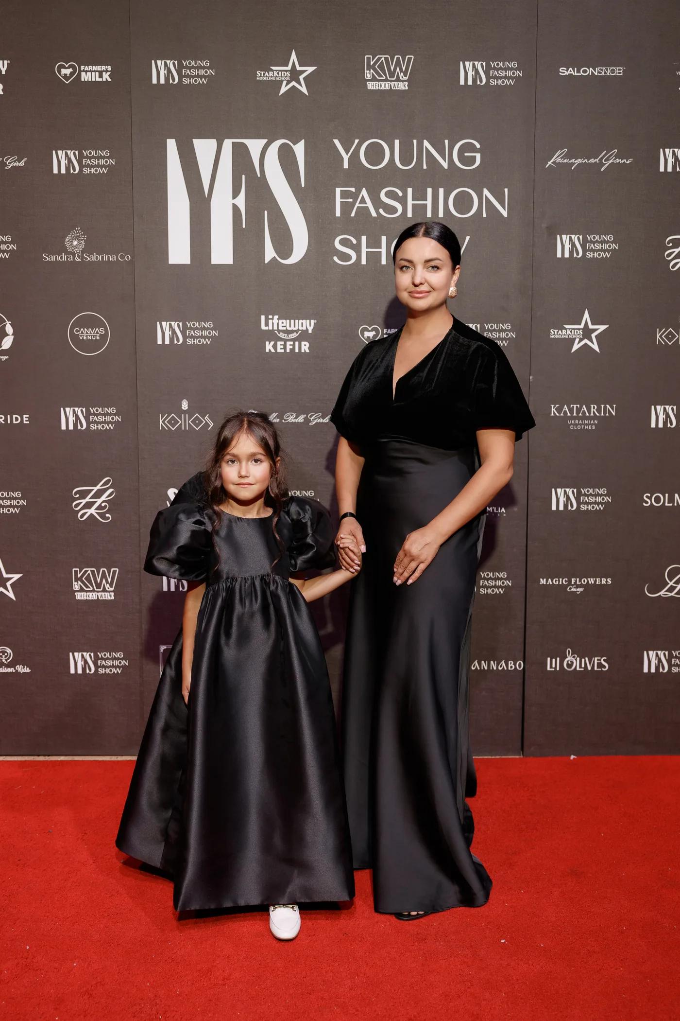 A young participant and her mother on the YFS red carpet