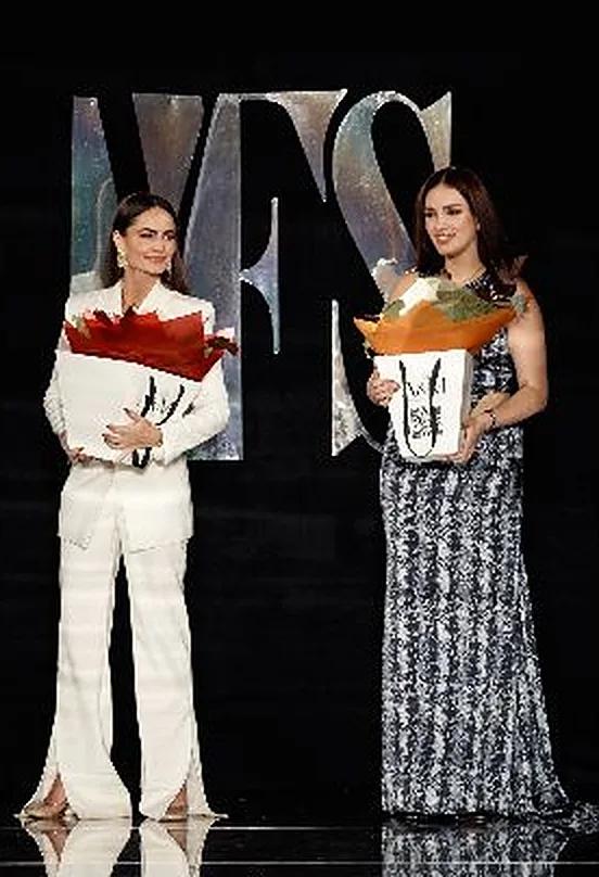 Julia and Khrystyna, co-founders of BUNDI, on the YFS runway with their collection
