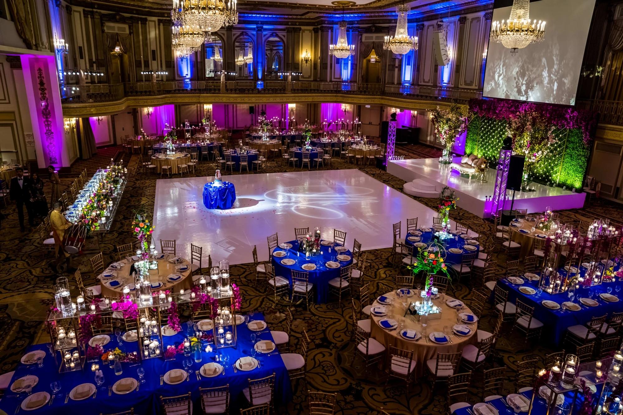 A Palmer House Hilton ballroom lit in violet under gilded ceilings, Chicago