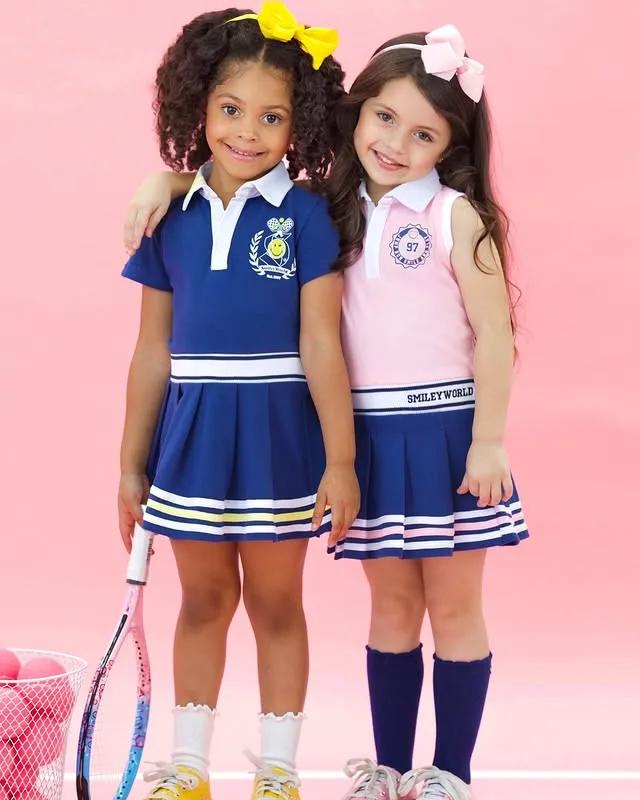 Two girls in Mia Belle Girls tennis-inspired looks