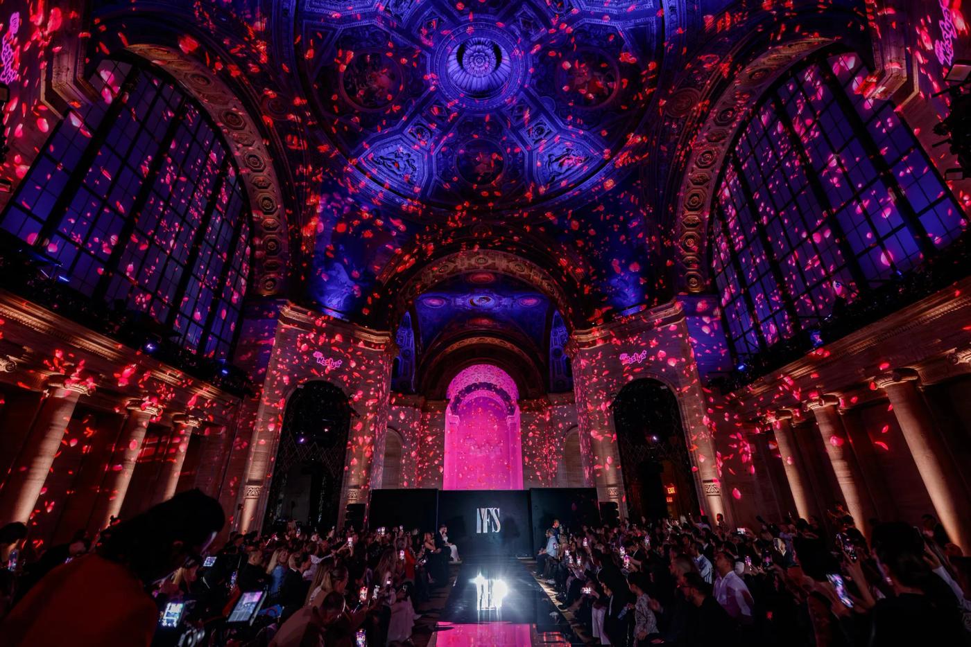 A YFS show in progress beneath an illuminated vaulted ceiling