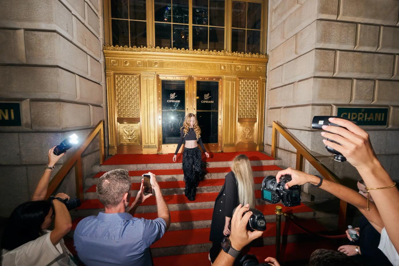 Photographers at the venue entrance during red carpet arrivals