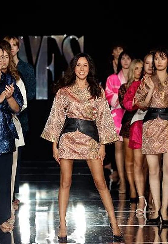 Margo, owner of HINKELMAN, on the YFS runway with her models