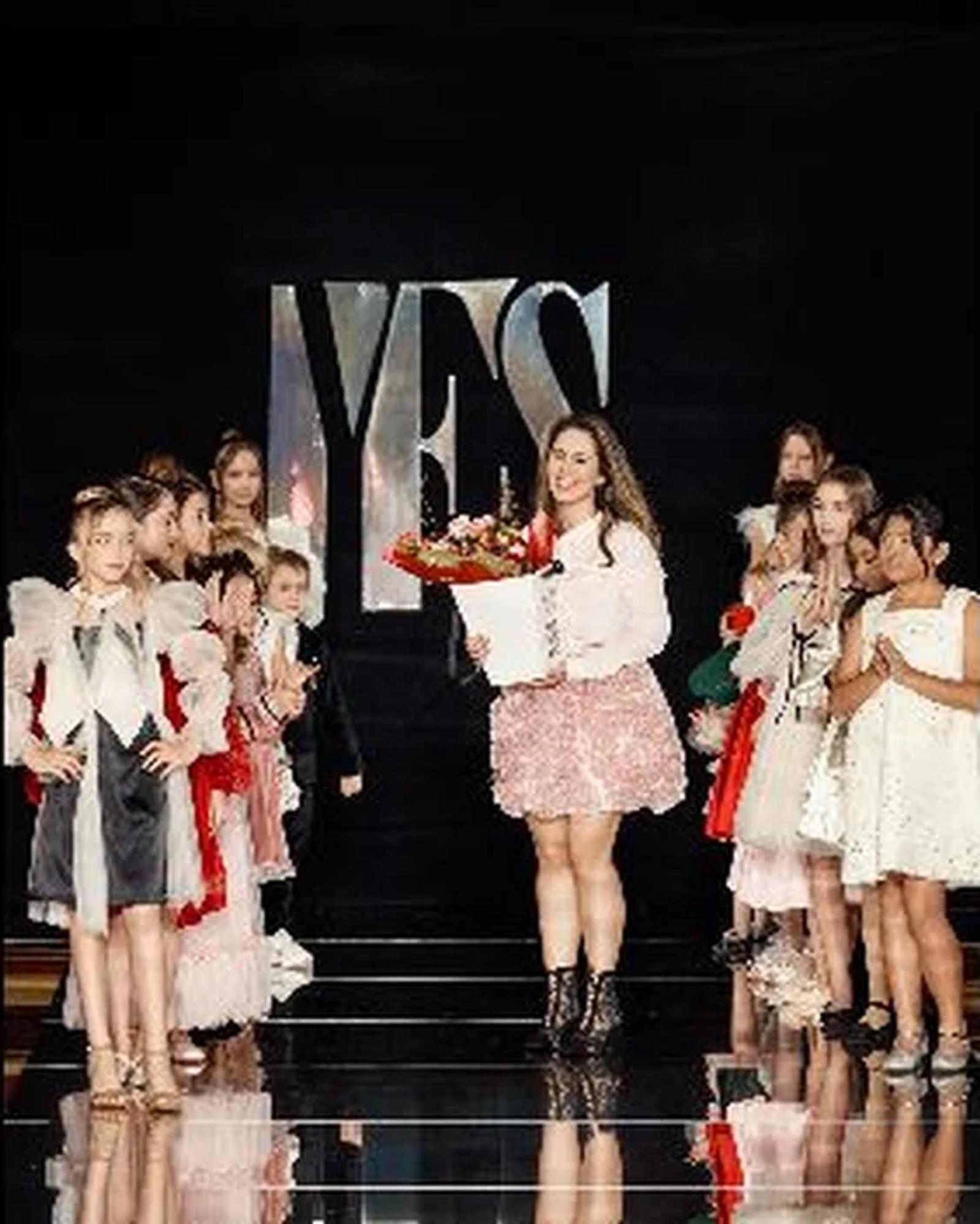 Katerina Azarova, owner of Petite Maison Kids, on the YFS runway with her collection