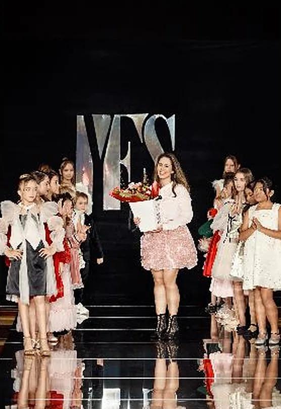 Katerina Azarova, owner of Petite Maison Kids, on the YFS runway with her collection