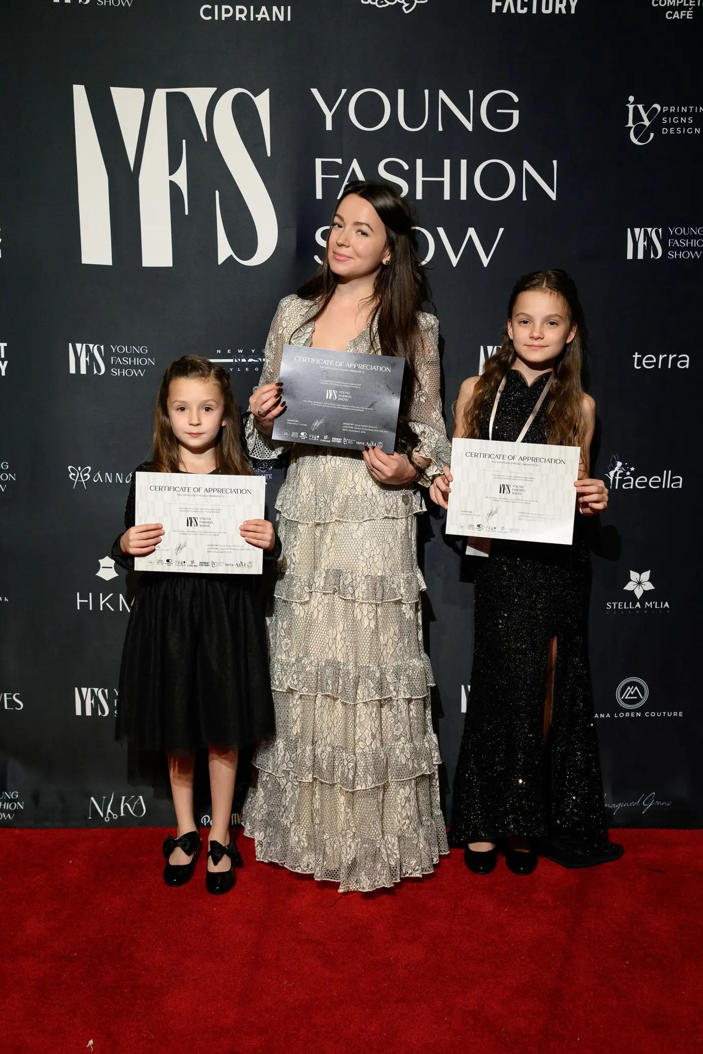 Participants holding certificates on the YFS red carpet