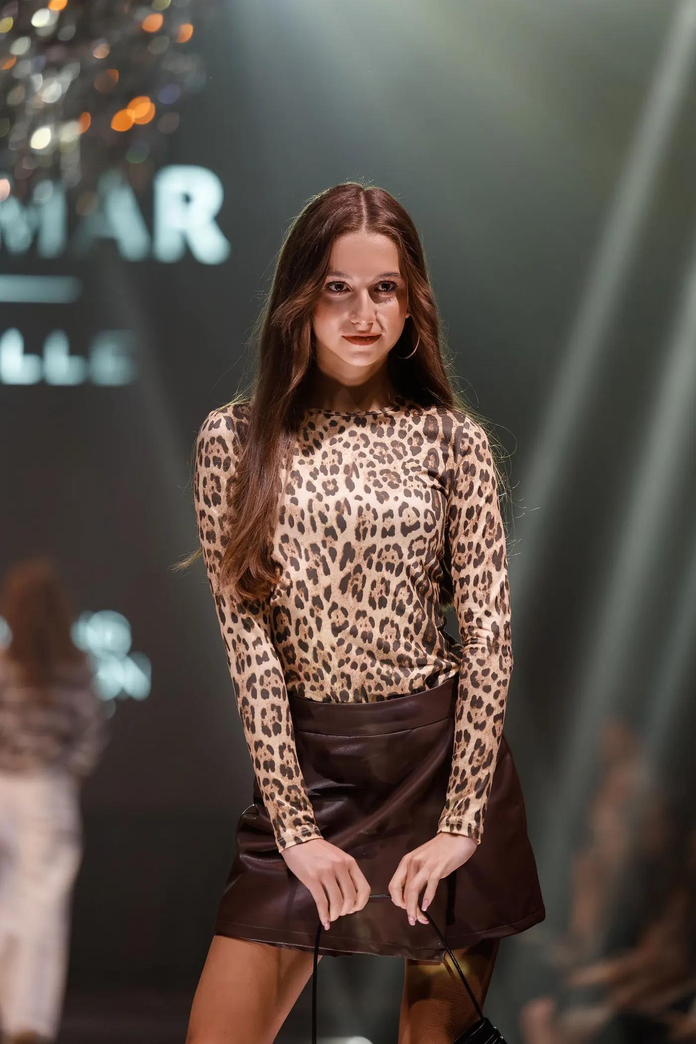 Teen girl walking the runway