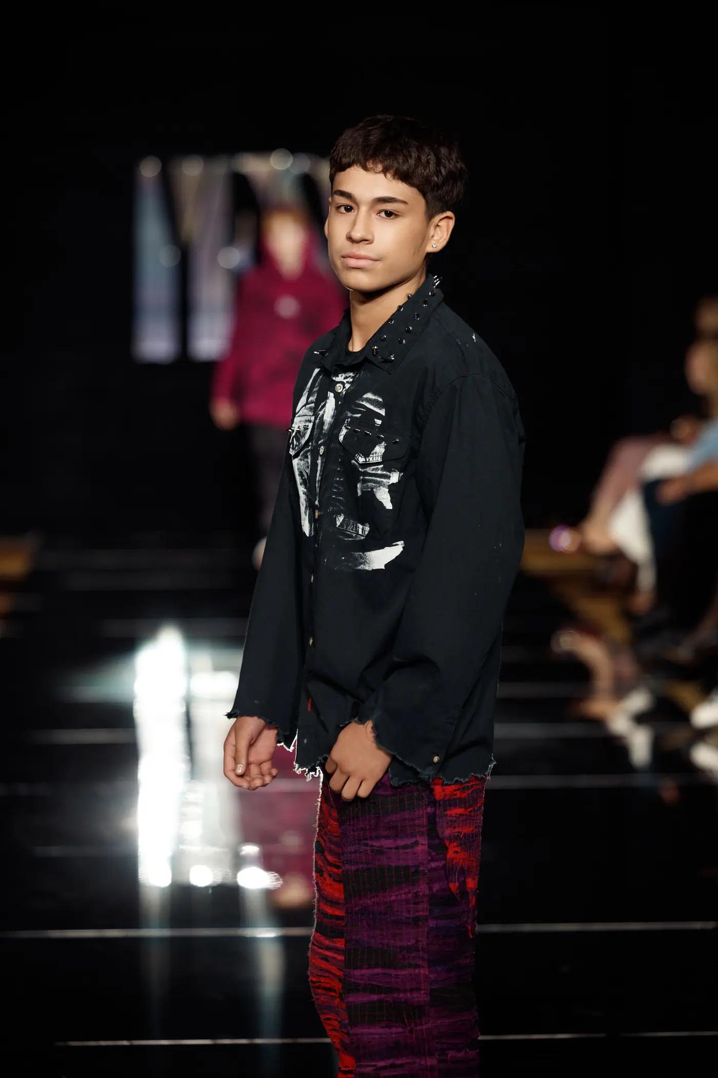 A teen boy walking the YFS runway