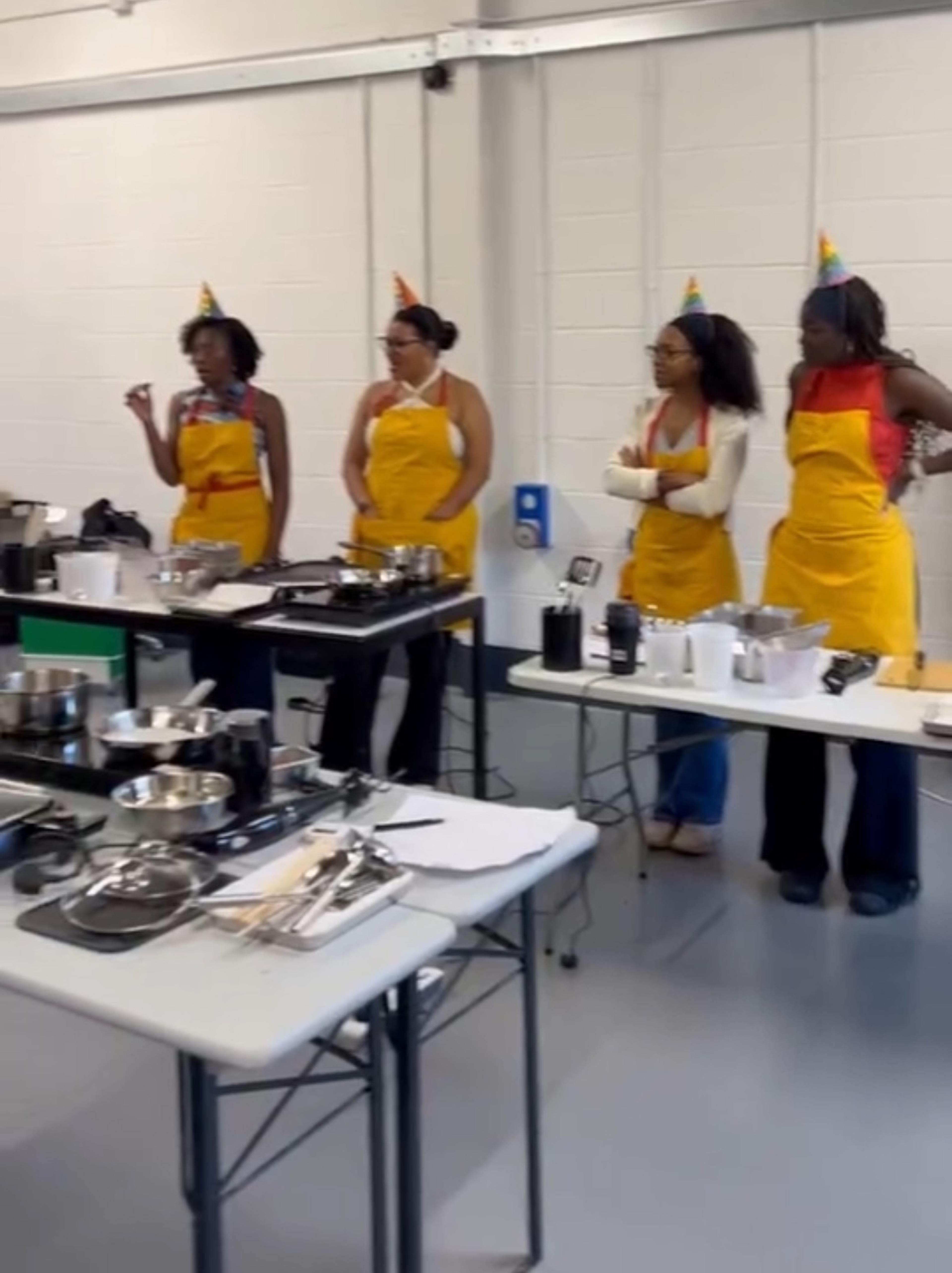 Students at a private cookery class for a birthday celebration.