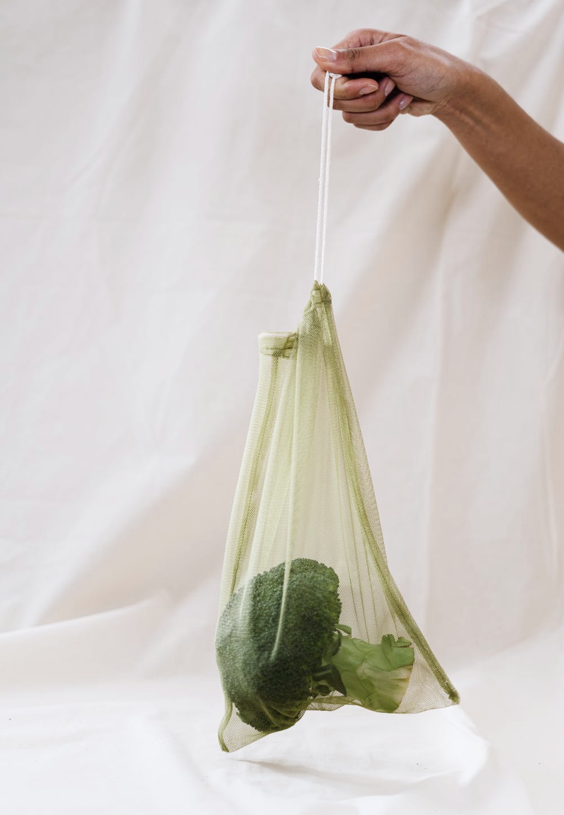 A broccoli in a see through eco friendly bag