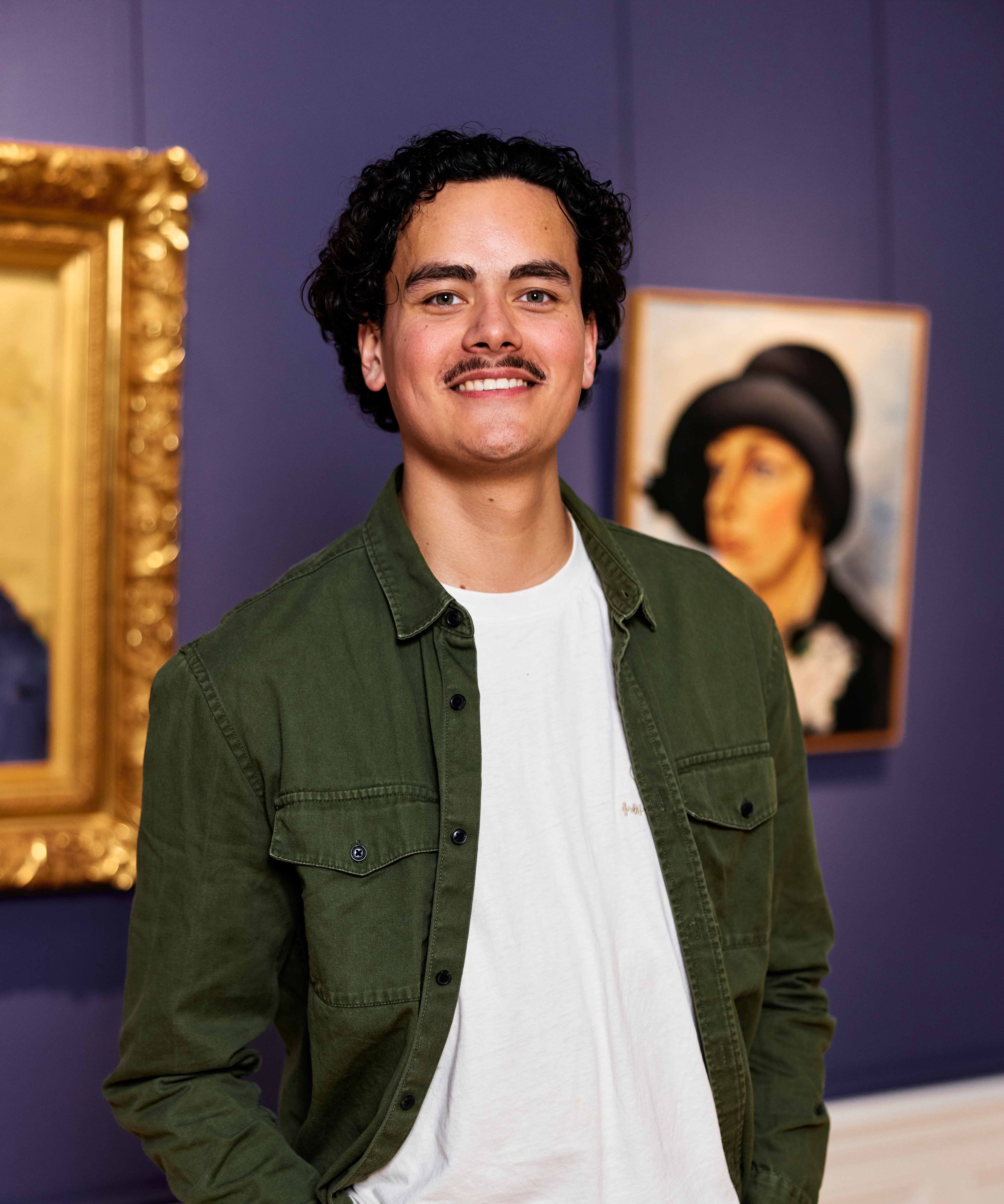 Visitor posing in front of a painting by Charley Toorop at the Frans Hals Museum.