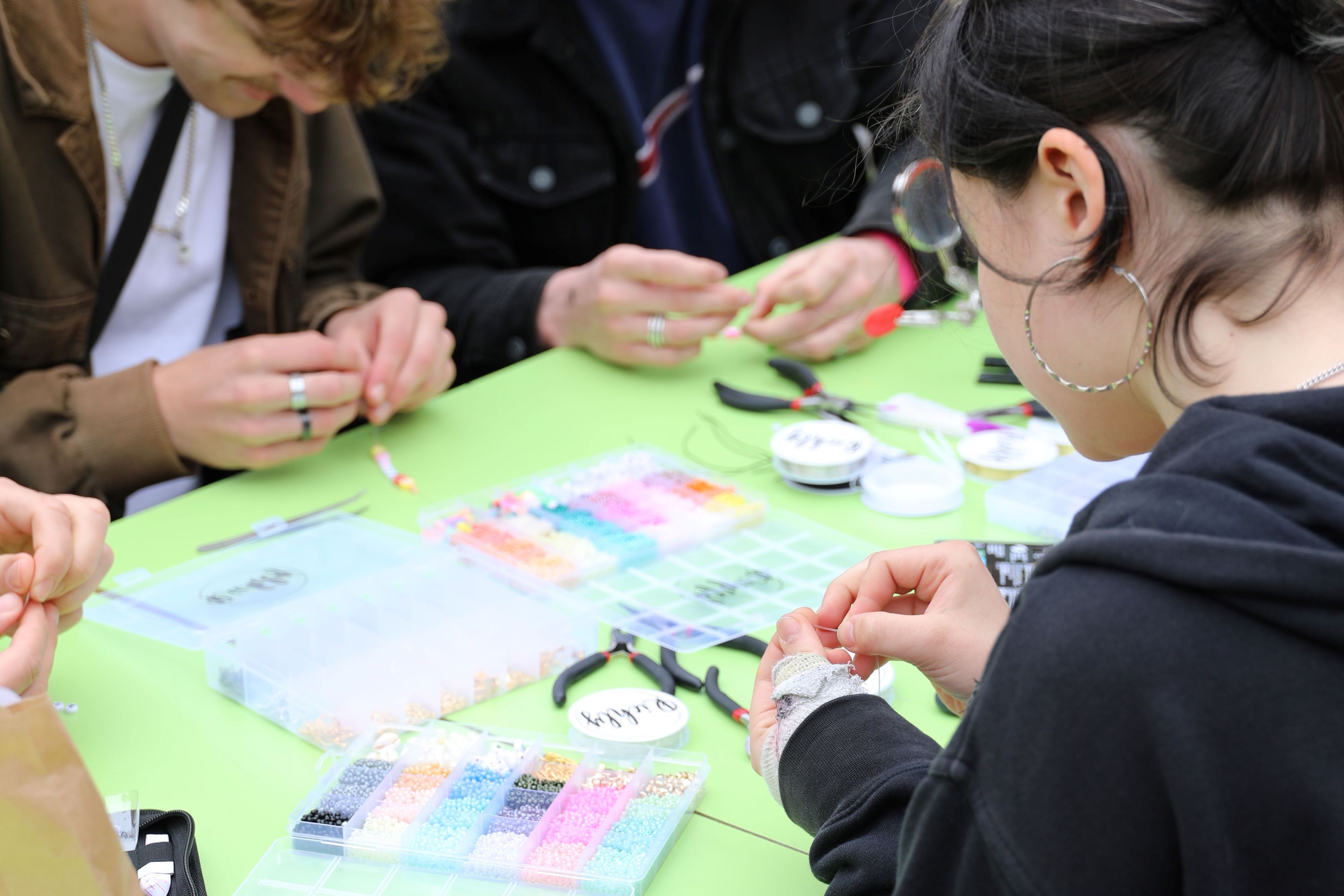 Jewellery making during outside the box festival.