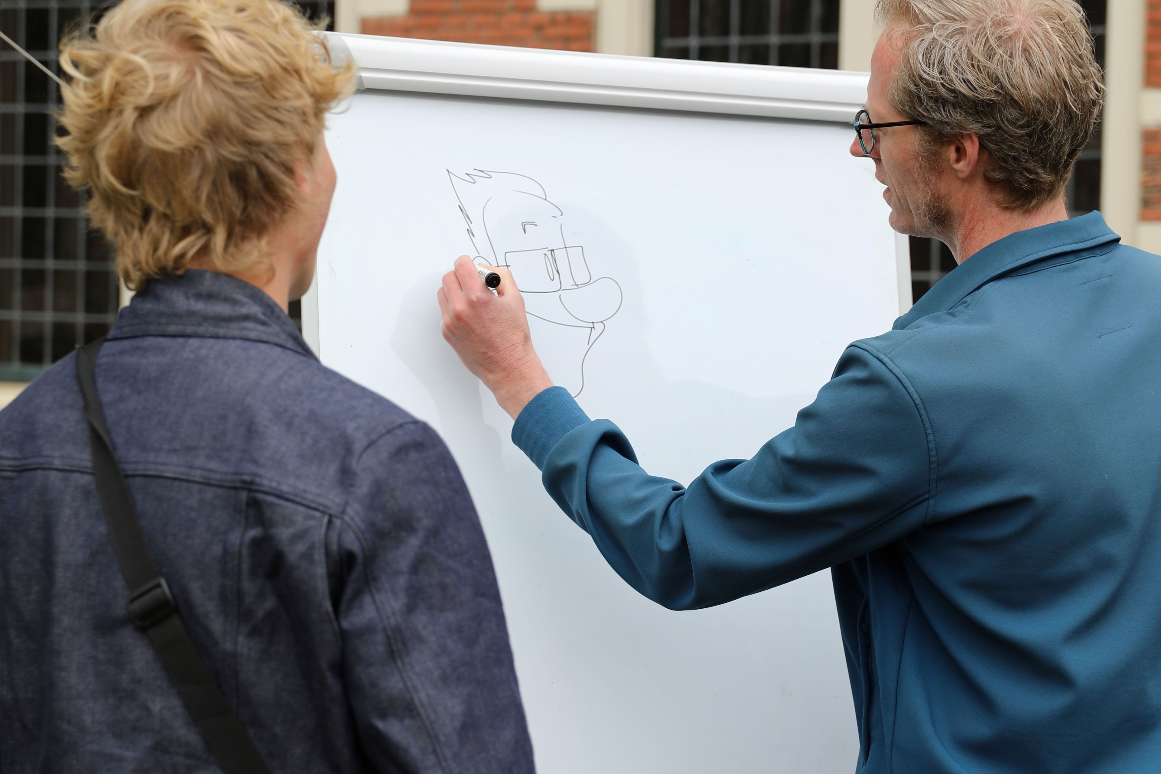 Cartooning during outside the box festival.