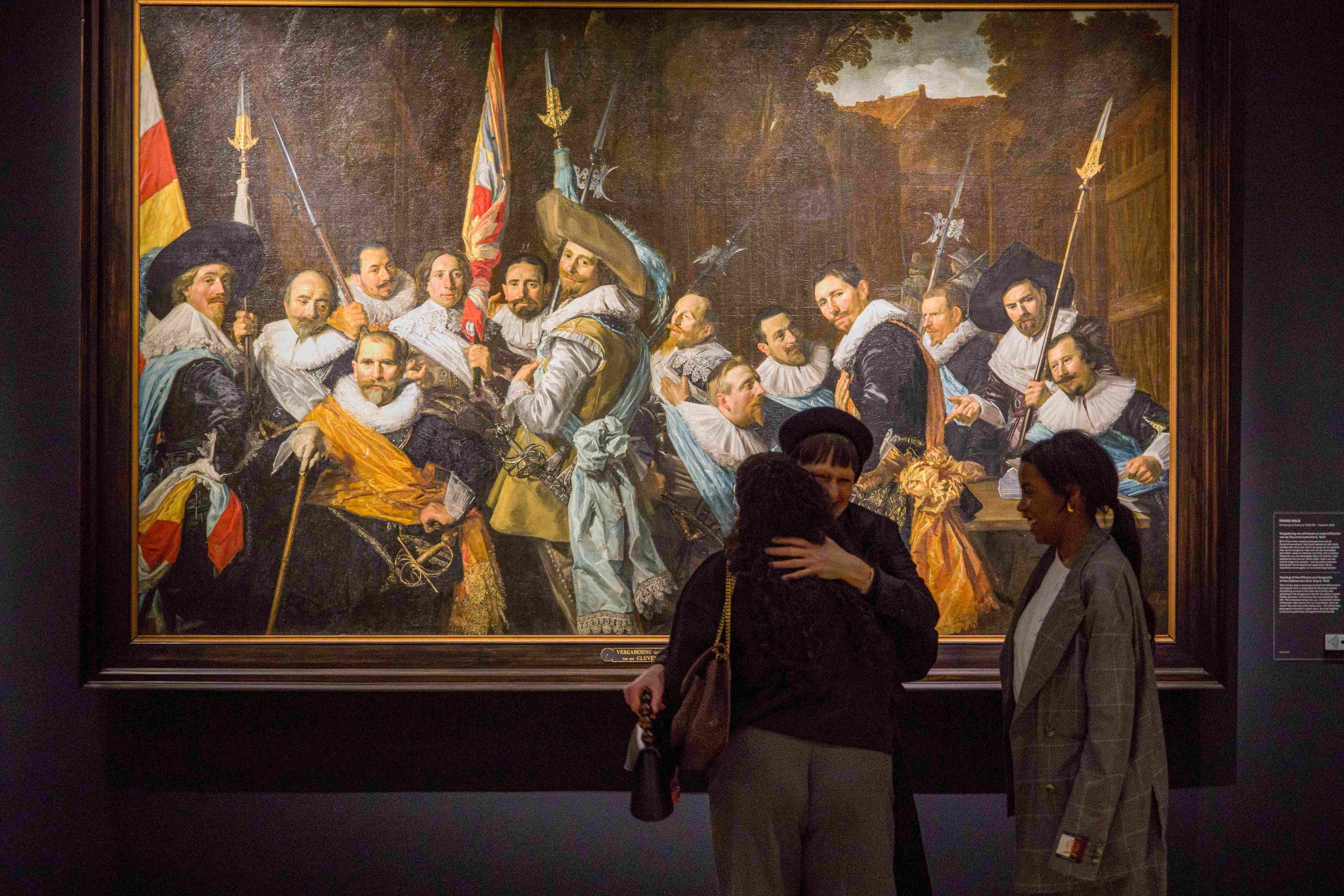 Visitors near a group portrait of civic guards by Frans Hals in the Civic Guard Gallery (Schutterszaal) 