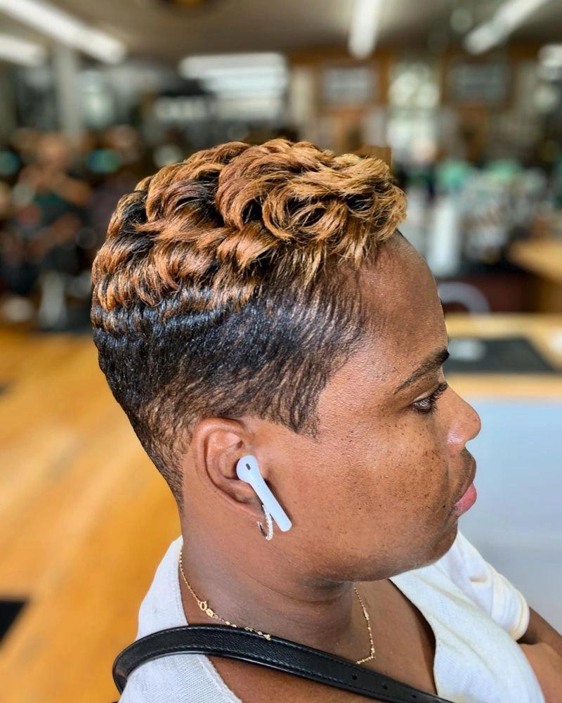 Short pixie cut with copper highlights and finger waves