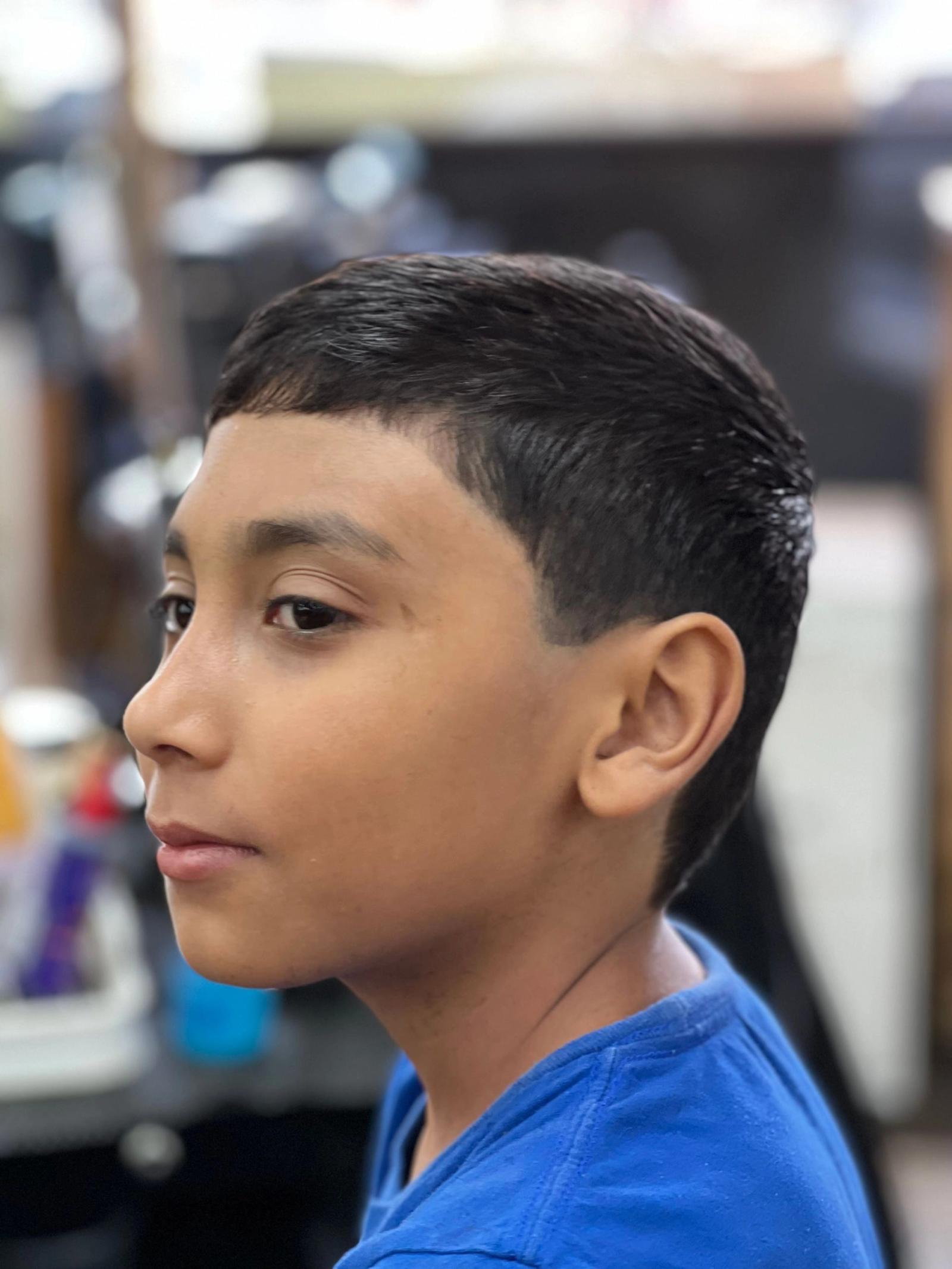 Young boy's short taper fade haircut, finished look