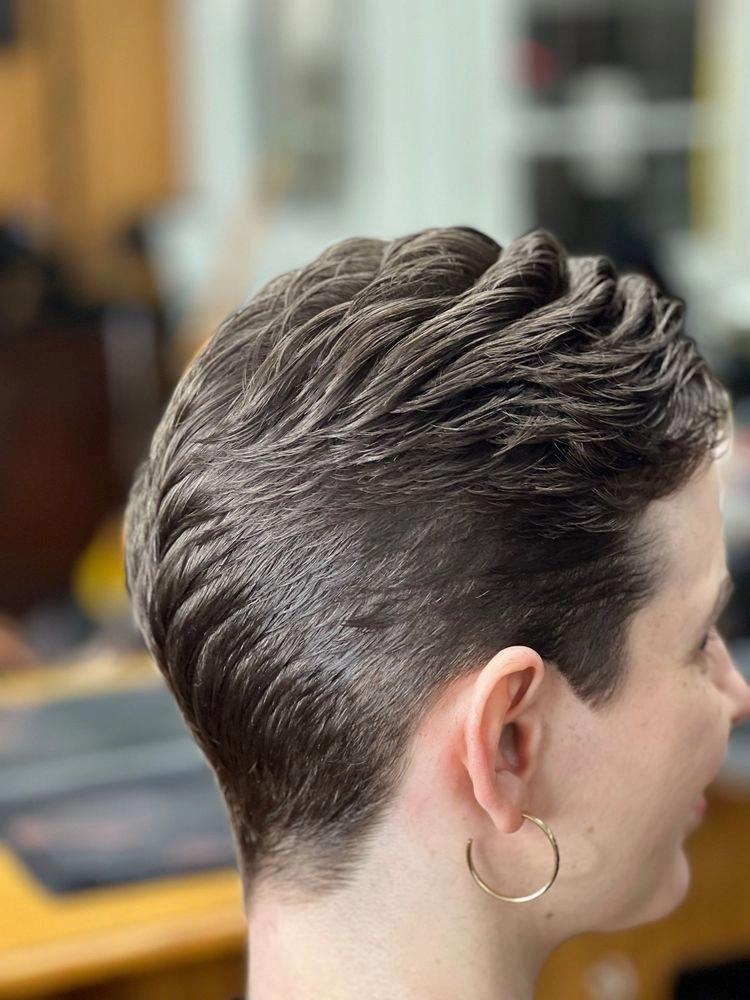 Short sleek pixie cut with a brown undercut