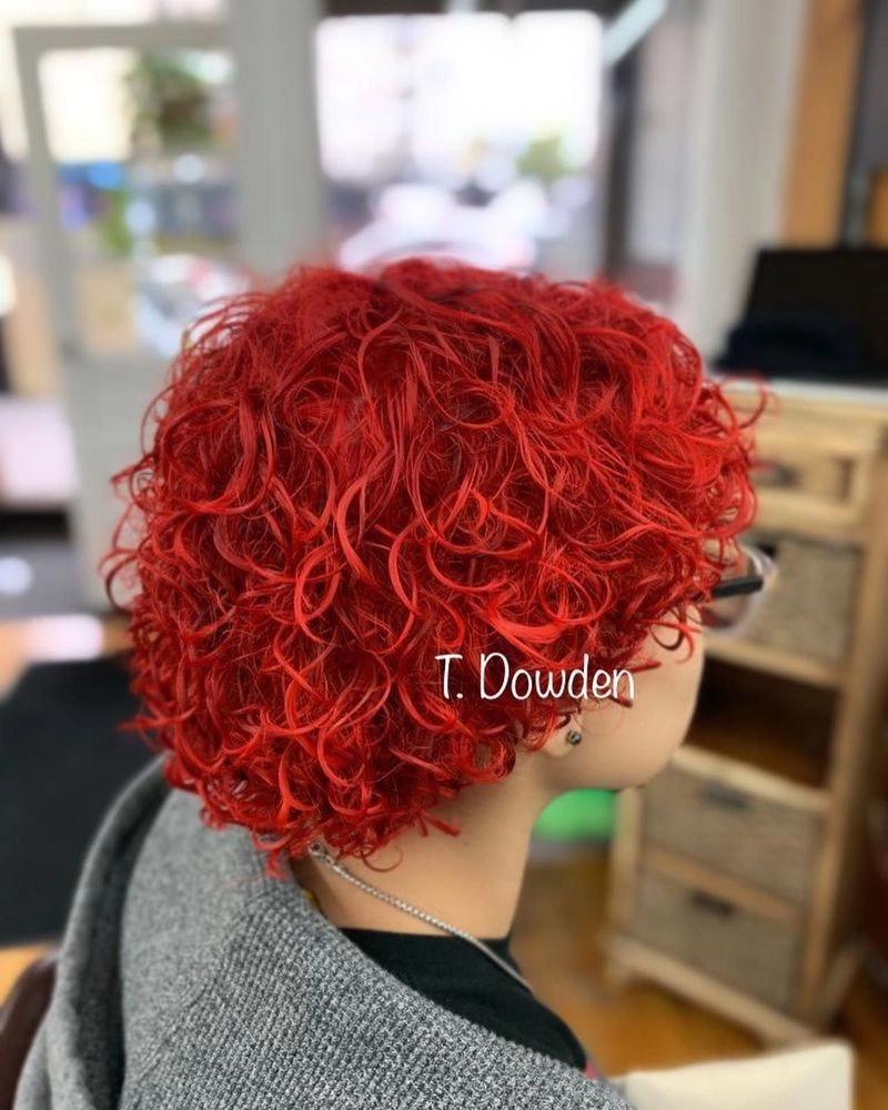 Short red curly hair after a cut and color