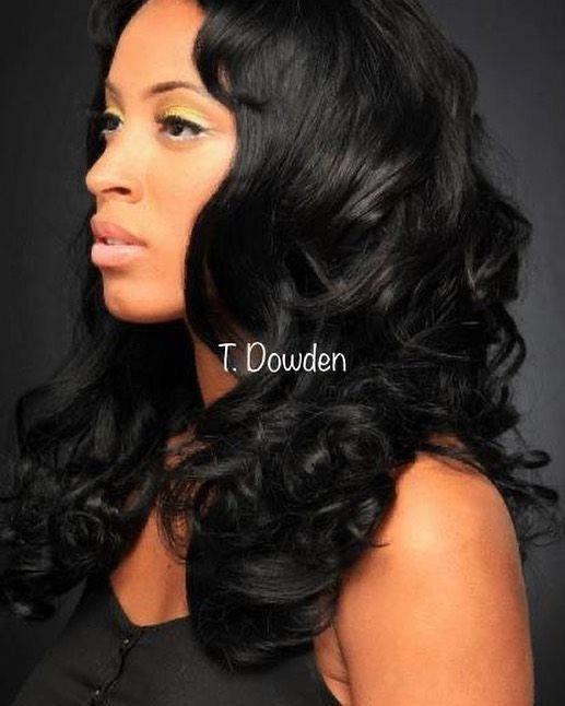 Long black voluminous curls styled at Level 1 Beauty Lounge
