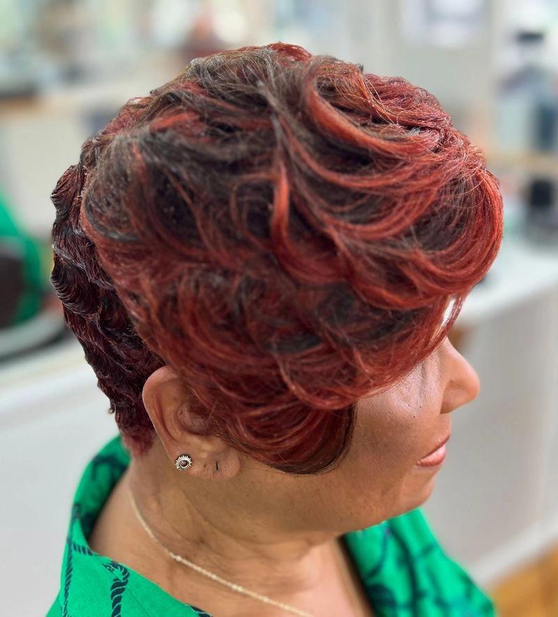 Short red-burgundy pixie cut with finger waves