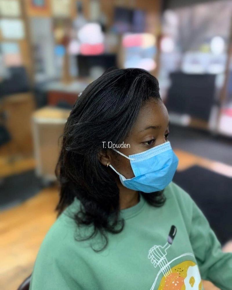 Sleek silk press on shoulder-length black hair