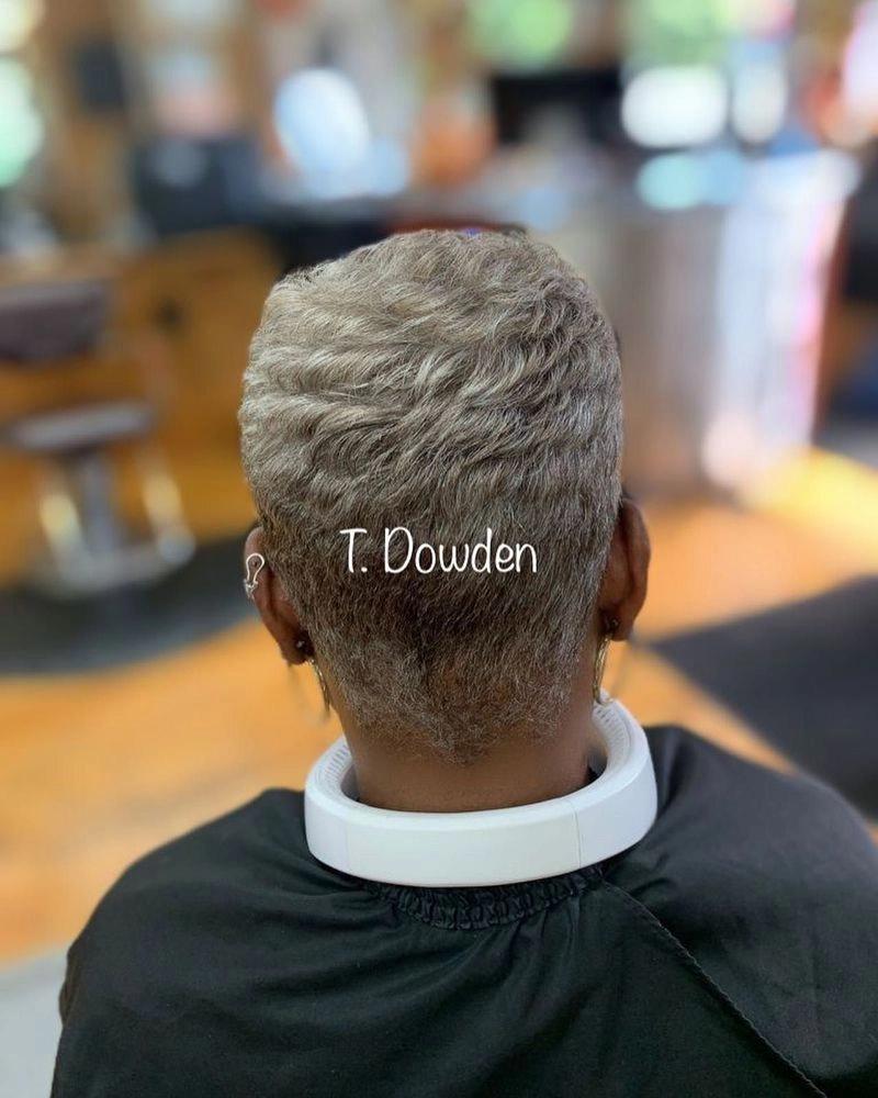 Short silver-gray pixie cut, seen from behind