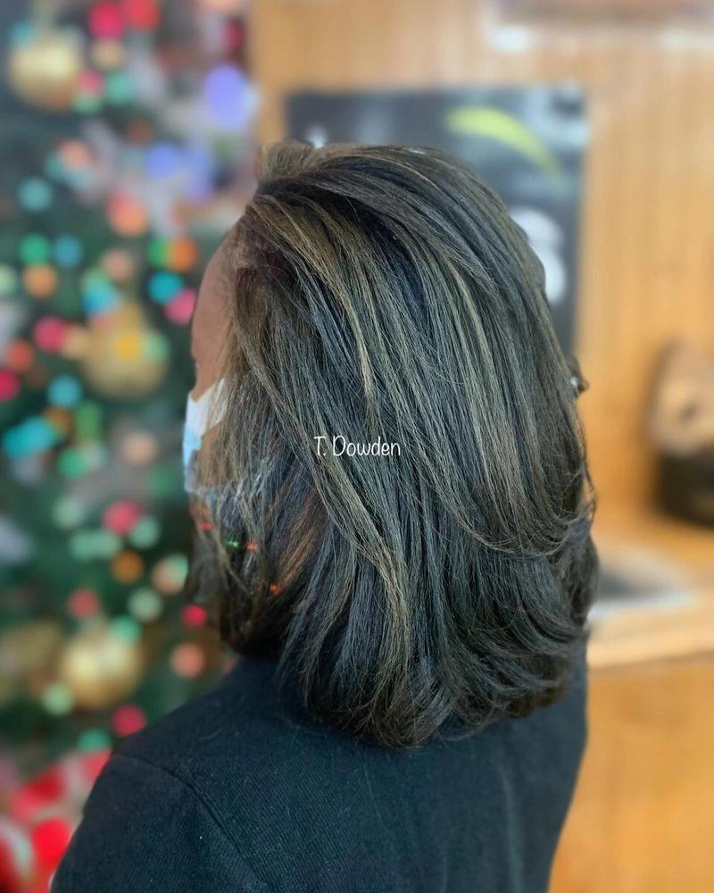 Layered bob haircut with caramel highlights on medium brown hair