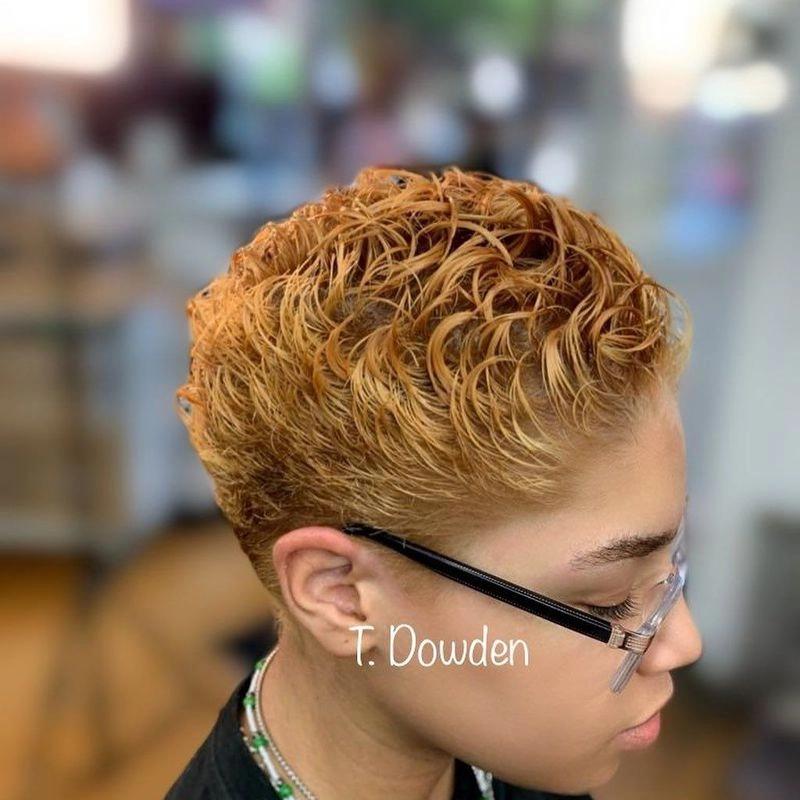Short curly pixie cut in copper-blonde color