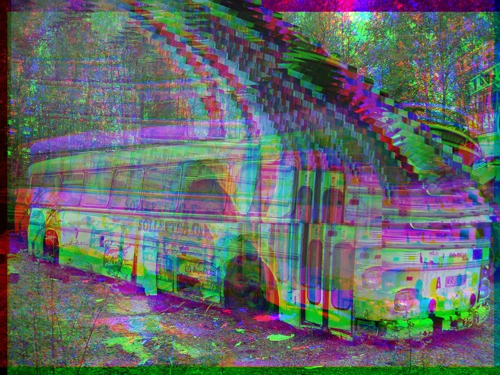 Distorted architectural image crossed by rainbow-coloured bands.