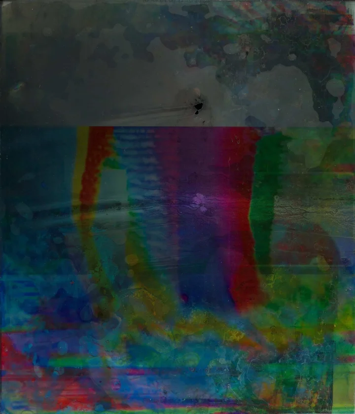 Dark layered image with central red, blue and green vertical bands.