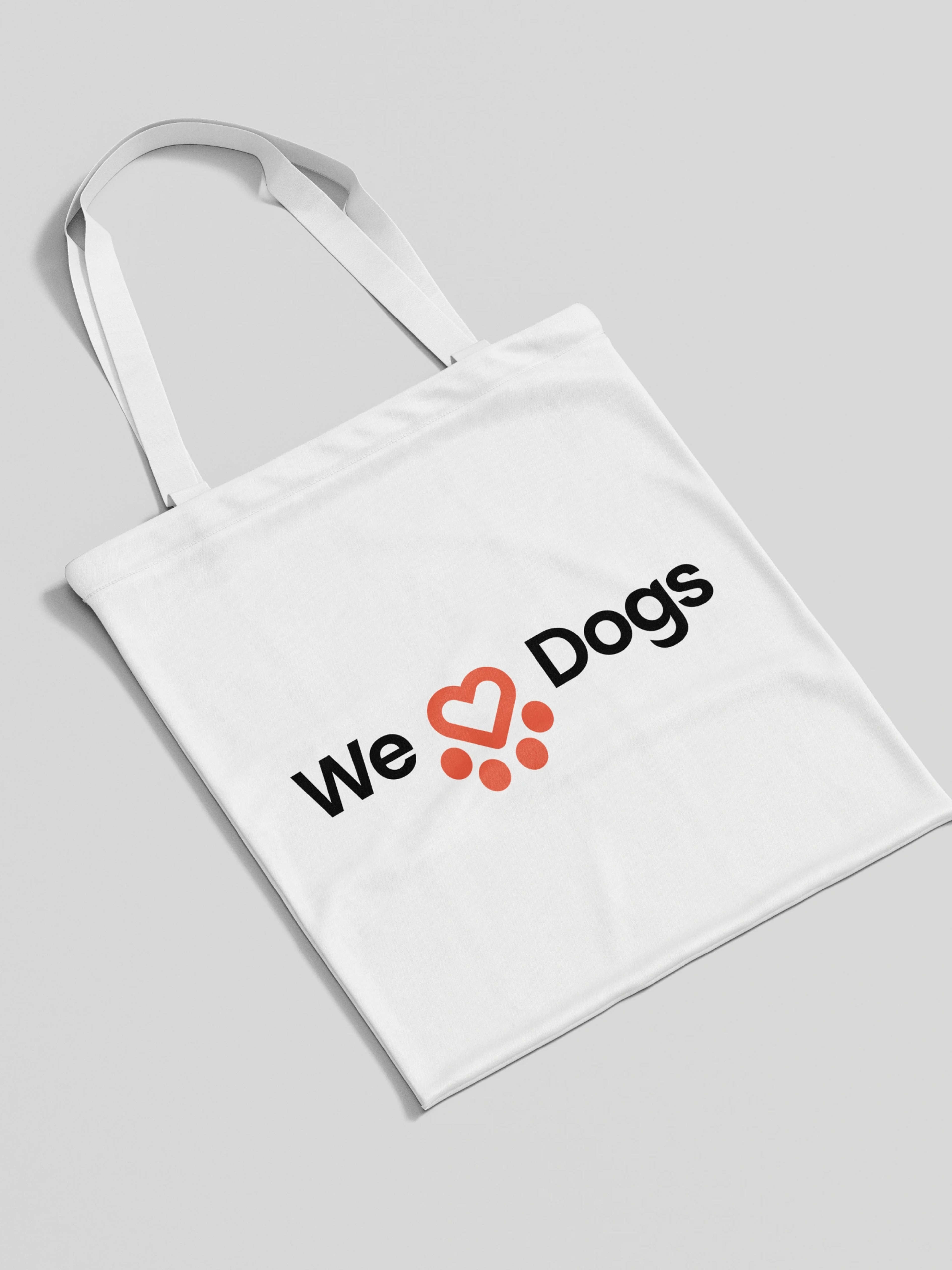 Spanish Stray Dogs logo on a tote bag spelling out "We Love Dogs"