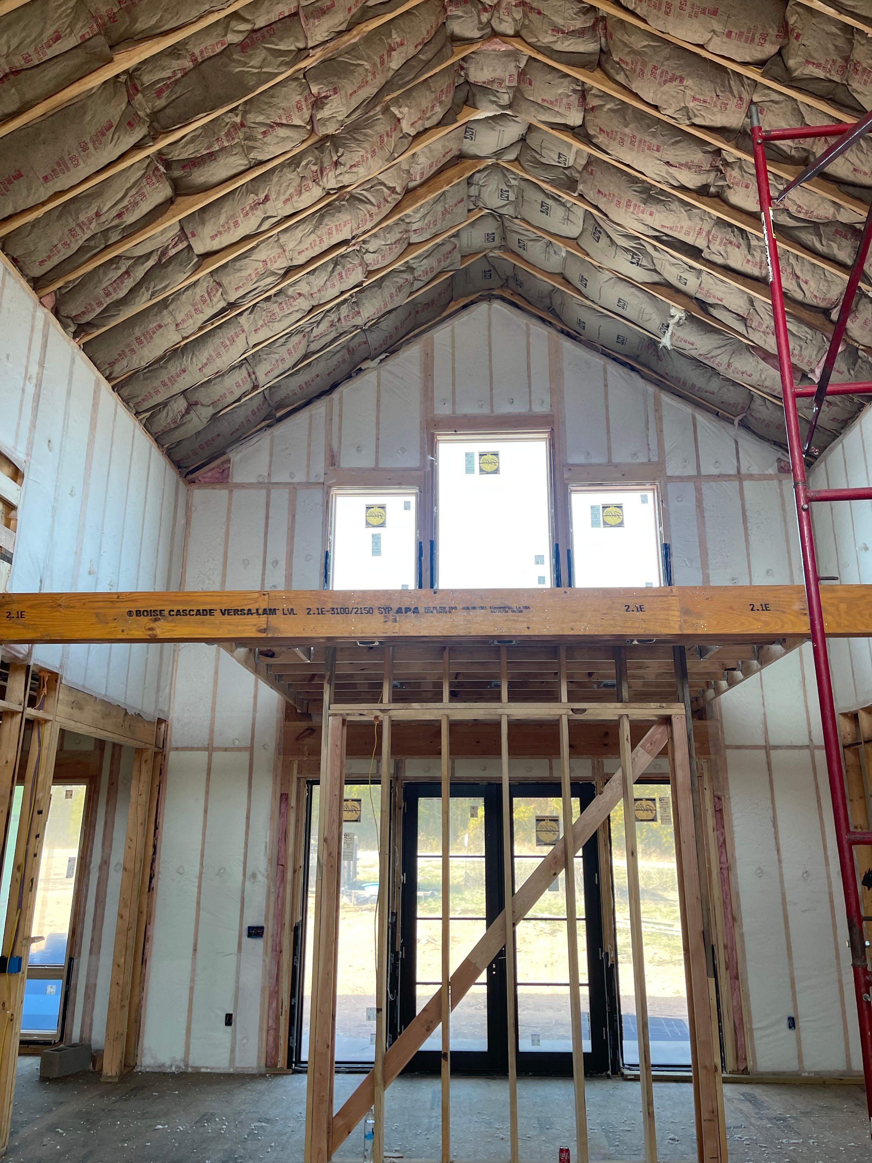 A vaulted great room where BIBS walls and ceiling batts were the right system instead of foam everywhere