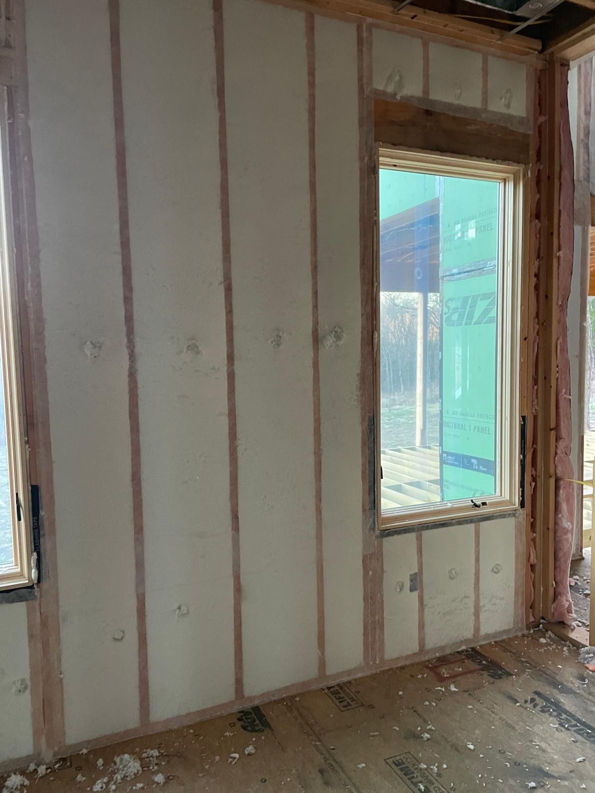 BIBS blow-in blanket wall insulation behind its fabric membrane in a Bella Vista home
