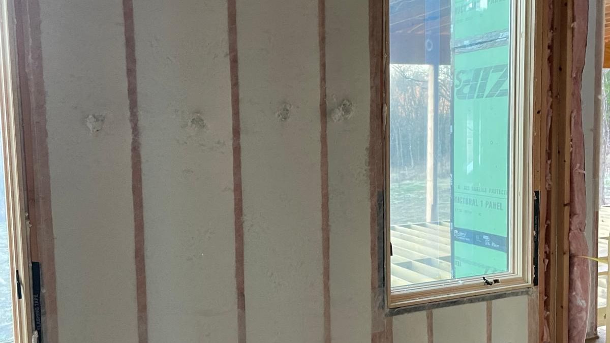 BIBS blow-in blanket wall insulation behind its fabric membrane in a Bella Vista home
