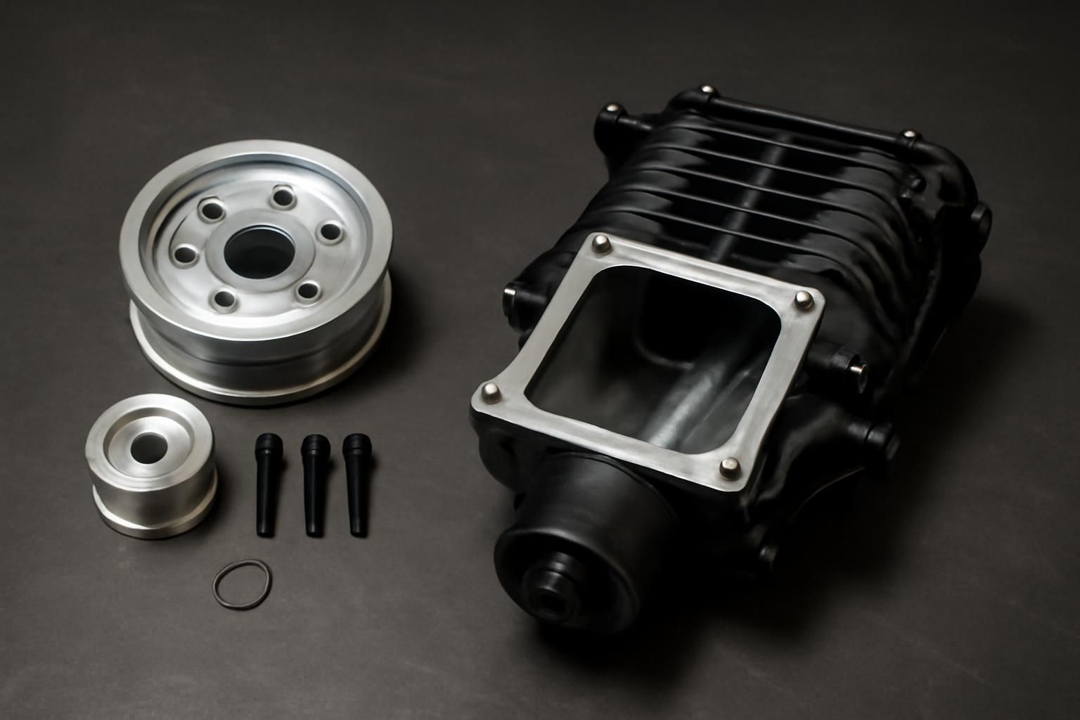 Hellcat supercharger pulley upgrade kit beside a ported supercharger snout comparison