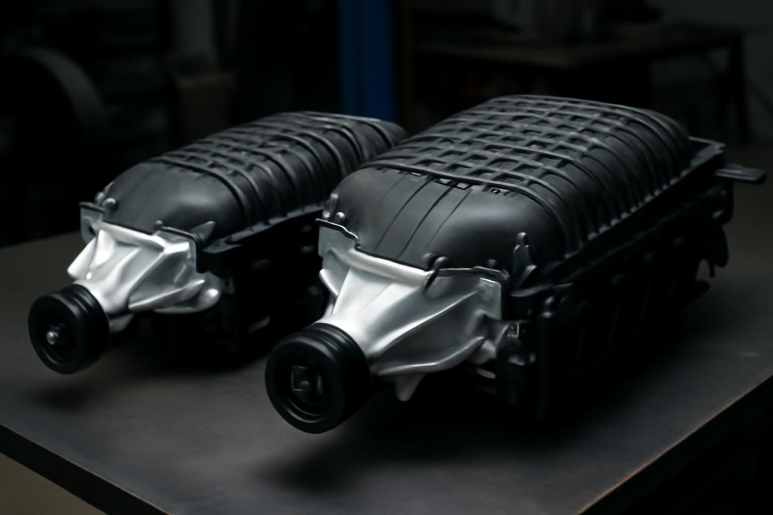 2.4L TVS2300 and 2.7L TVS Hellcat superchargers side by side showing size difference