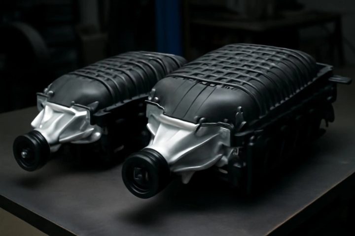 2.4L TVS2300 and 2.7L TVS Hellcat superchargers side by side showing size difference