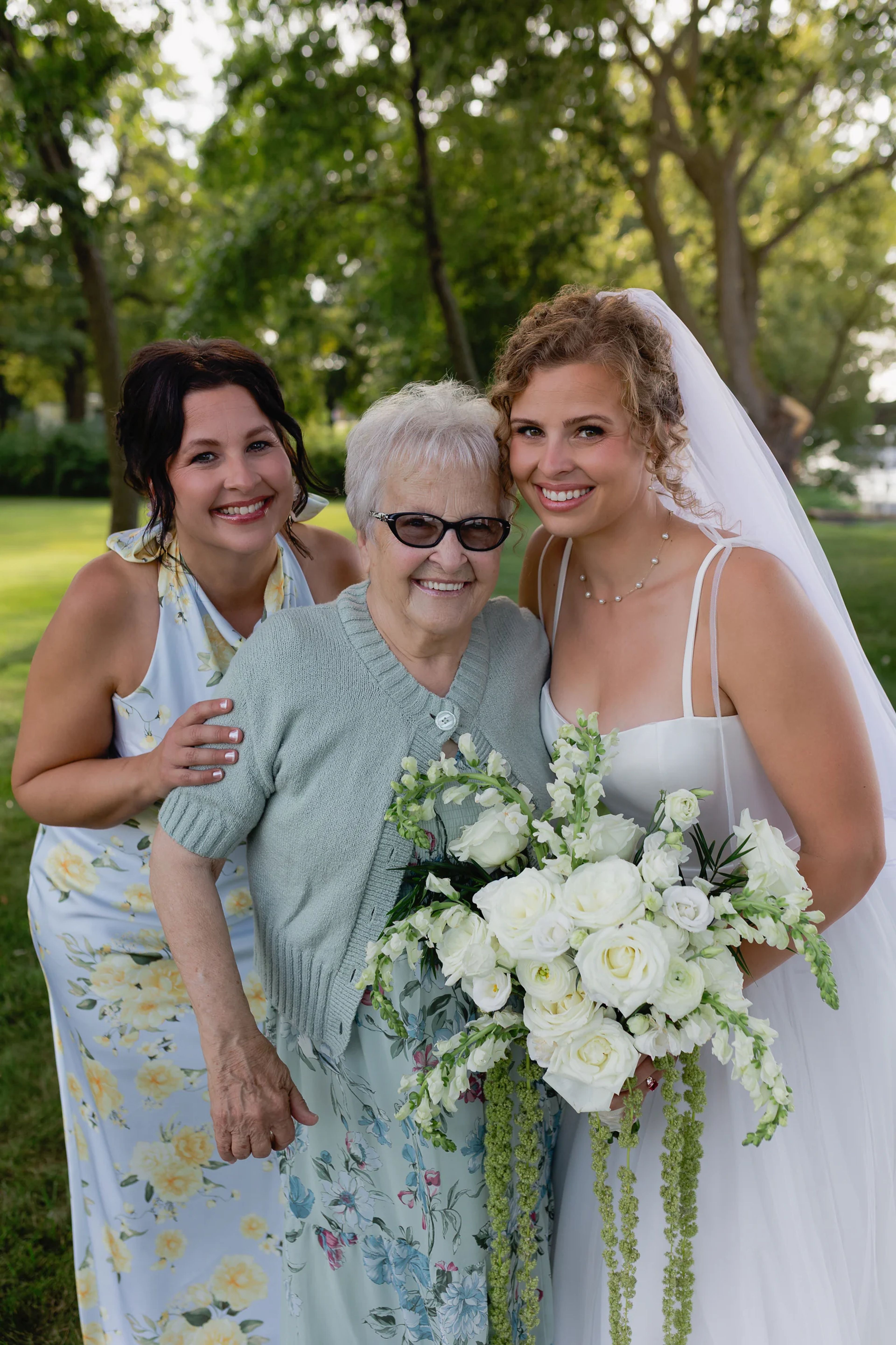 Sierra with her mother and grandmother, three generations of florists, smiling together.