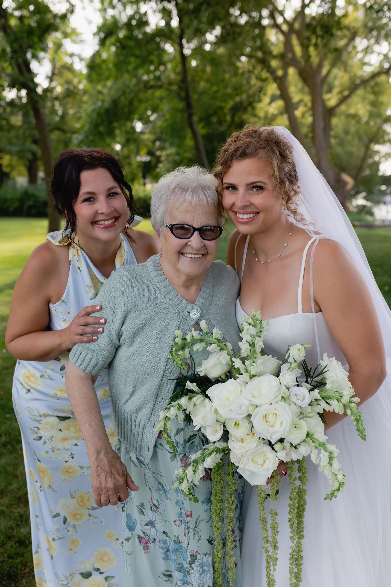 Sierra with her mother and grandmother, three generations of florists, smiling together.