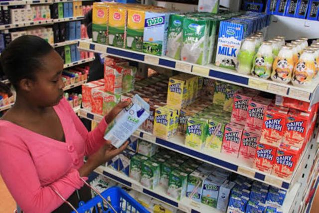 A shopper near the milk section in a Nairobi supermarket: A biting milk shortage against high prices hits Kenya and especially Nairobi region